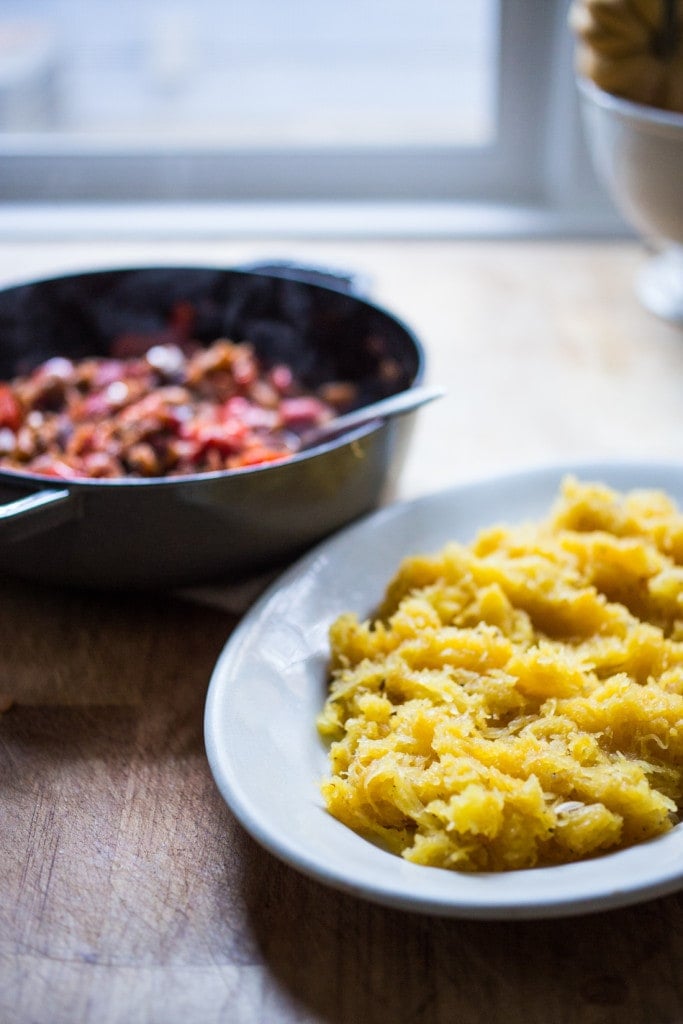 Roasted Spaghetti Squash with Eggplant Puttanesca Sauce- a rich, robust vegetarian meal that is low in carbs, keto and gluten free! Easy and simple. | #keto #spaghettisquash #eggplant #puttnesca #vegan #vegandinner 