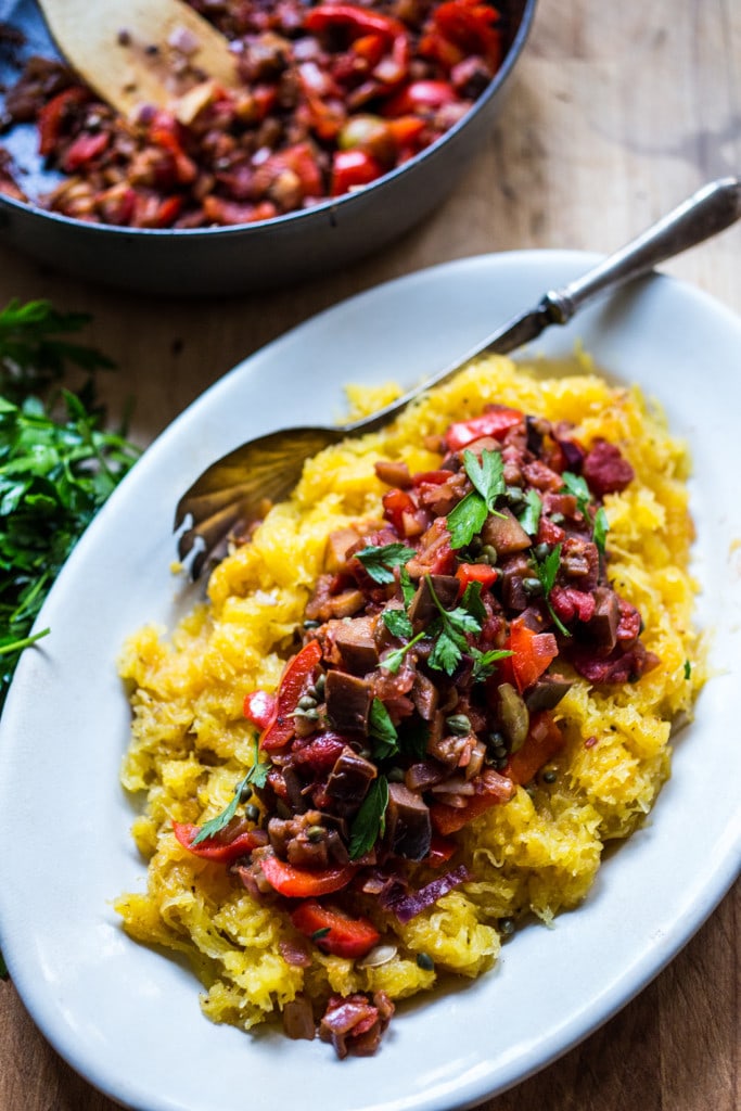 Roasted Spaghetti Squash with Eggplant Puttanesca Sauce- a rich, robust vegetarian meal that is low in carbs, keto and gluten free! Easy and simple. | #keto #spaghettisquash #eggplant #puttnesca #vegan #vegandinner 