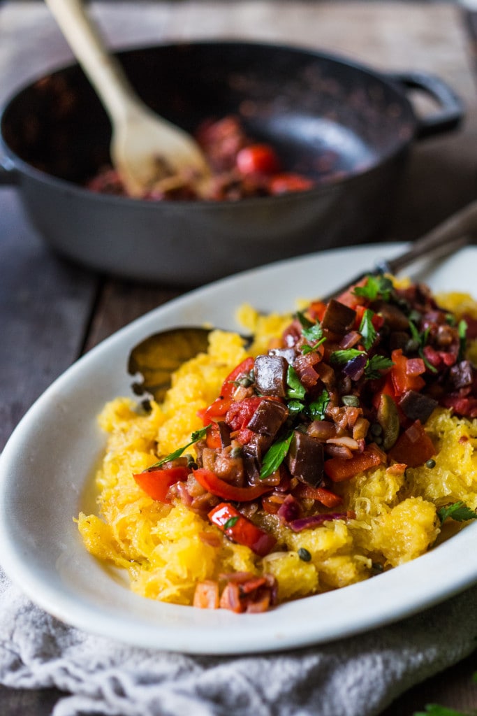  Roasted Spaghetti Squash with Eggplant Puttanesca Sauce- a rich, robust vegetarian meal that is low in carbs, keto and gluten free! Easy and simple. | #keto #spaghettisquash #eggplant #puttnesca 