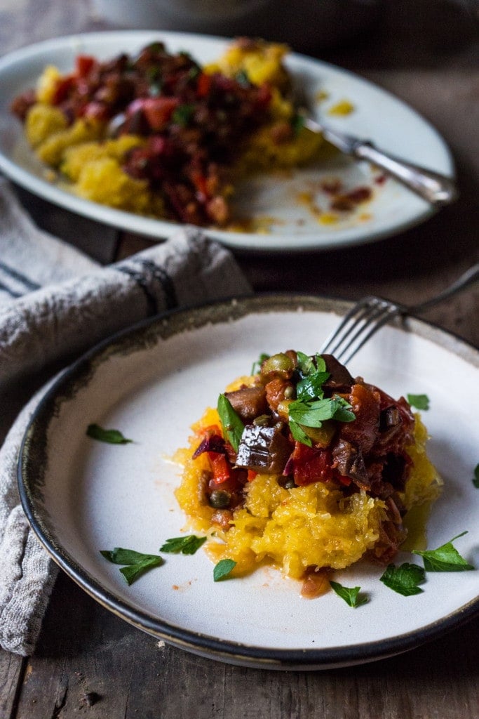 Roasted Spaghetti Squash with Eggplant Puttanesca Sauce- a rich, robust vegetarian meal that is low in carbs, keto and gluten free! Easy and simple. | #keto #spaghettisquash #eggplant #puttnesca #vegan #vegandinner 