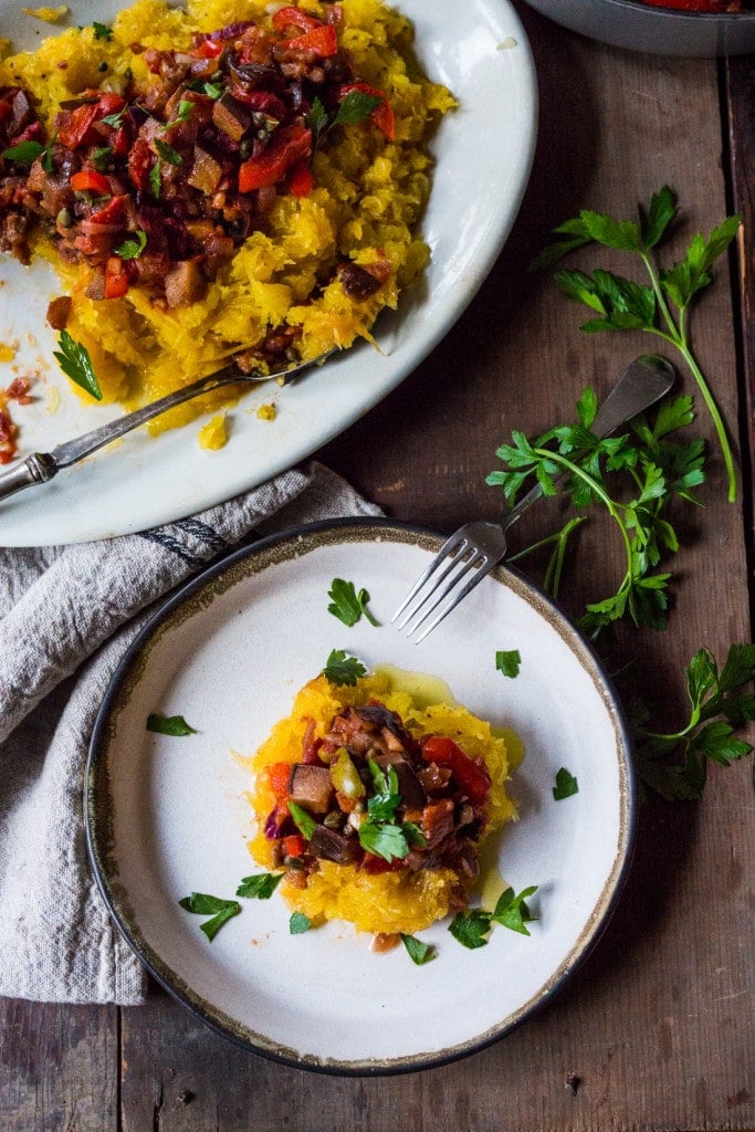 Roasted Spaghetti Squash with Eggplant Puttanesca Sauce- a rich, robust vegetarian meal that is low in carbs, keto and gluten free! Easy and simple. | #keto #spaghettisquash #eggplant #puttnesca #vegan #vegandinner 