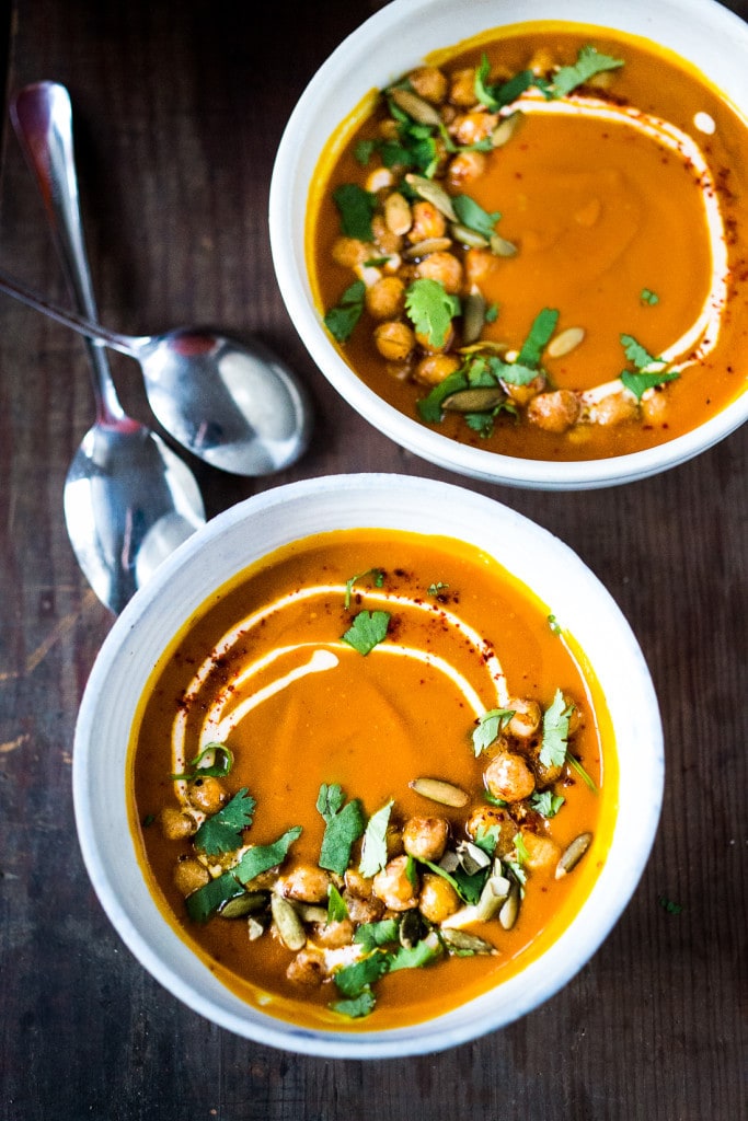 Roasted Kuri Squash Soup with Smokey Harissa, roasted chickpeas, toasted pumpkin seeds and "smoked" yogurt....a delicious vegetarian meal. | www.feastingathome.com