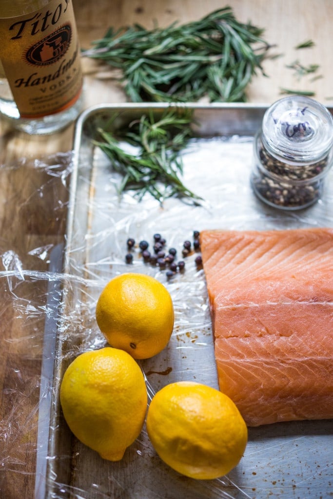 Have you ever made lox at home? It's so easy! This simple recipe for Salt Cured Salmon with rosemary, juniper berries (optional) vodka and lemon zest requires only a few minutes of prep, and then watch as nature takes its course. | www.feastingathome.com