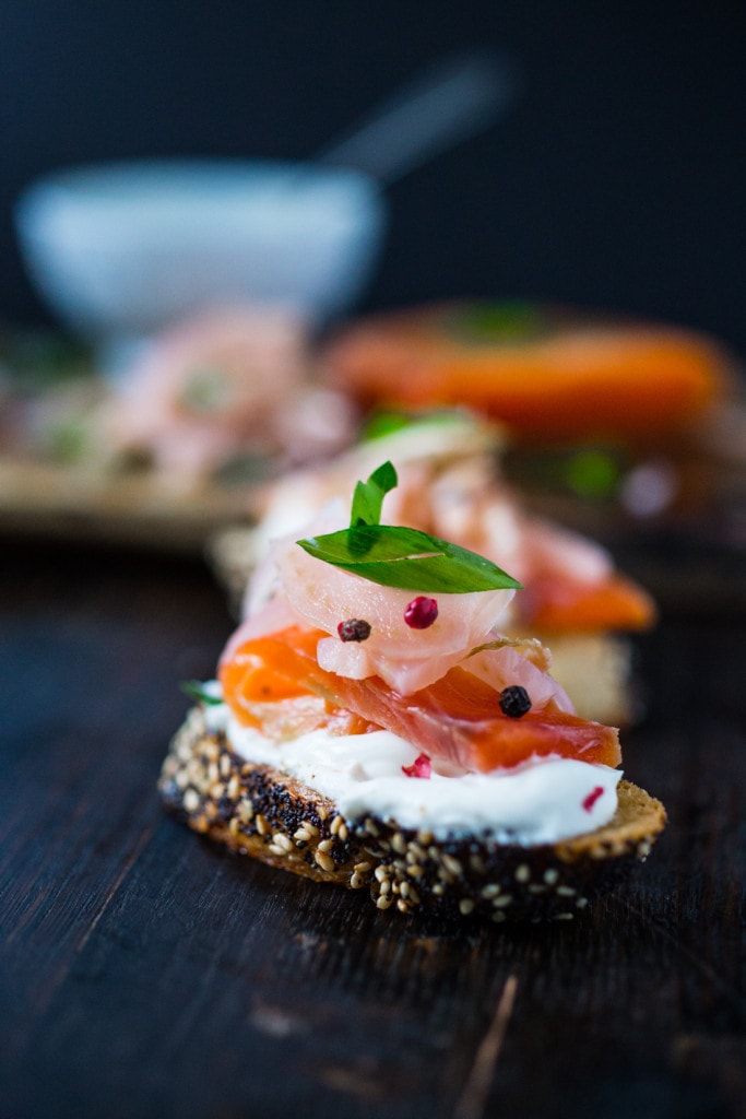 Lox and pickled fennel Bruschetta! This simple recipe for Salt Cured Salmon with rosemary, juniper berries (optional) vodka and lemon zest requires only a few minutes of prep, and then watch as nature takes its course. | www.feastingathome.com