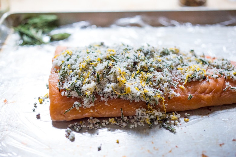 Have you ever made lox at home? It's so easy! This simple recipe for Salt Cured Salmon with rosemary, juniper berries (optional) vodka and lemon zest requires only a few minutes of prep, and then watch as nature takes its course. | www.feastingathome.com