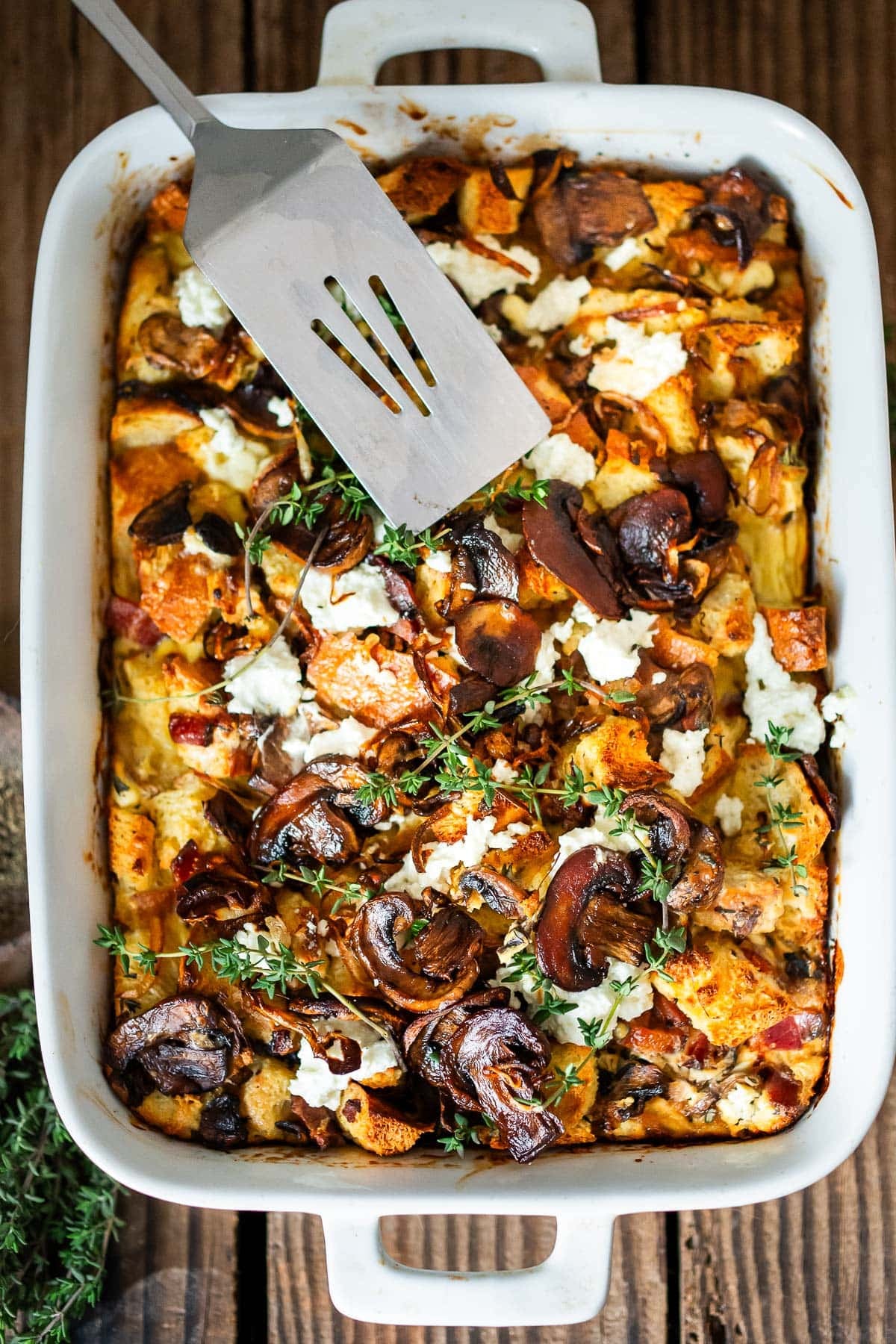 Baked Egg Casserole (aka Breakfast Strata) with mushrooms, caramelized onions, goat cheese, and thyme is perfect for the holidays. Make it ahead! Video included. 
