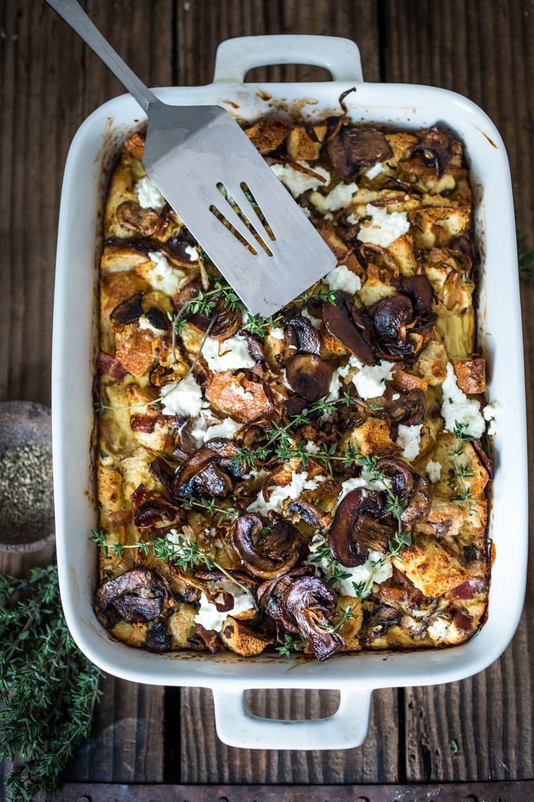 A delicious Baked Egg Casserole called Breakfast Strata with mushrooms, caramelized onions, goat cheese and thyme, perfect for the holidays. Make it ahead! | www.feastingathome.com