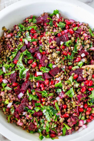 This lentil pomegranate salad is vibrant, flavorful, and packed with beets, herbs, and juicy pomegranate seeds. A healthy, protein-rich salad perfect for meal prep. Can also be served with tortilla chips for a festive appetizer dip. Vegan and Gluten-free.
