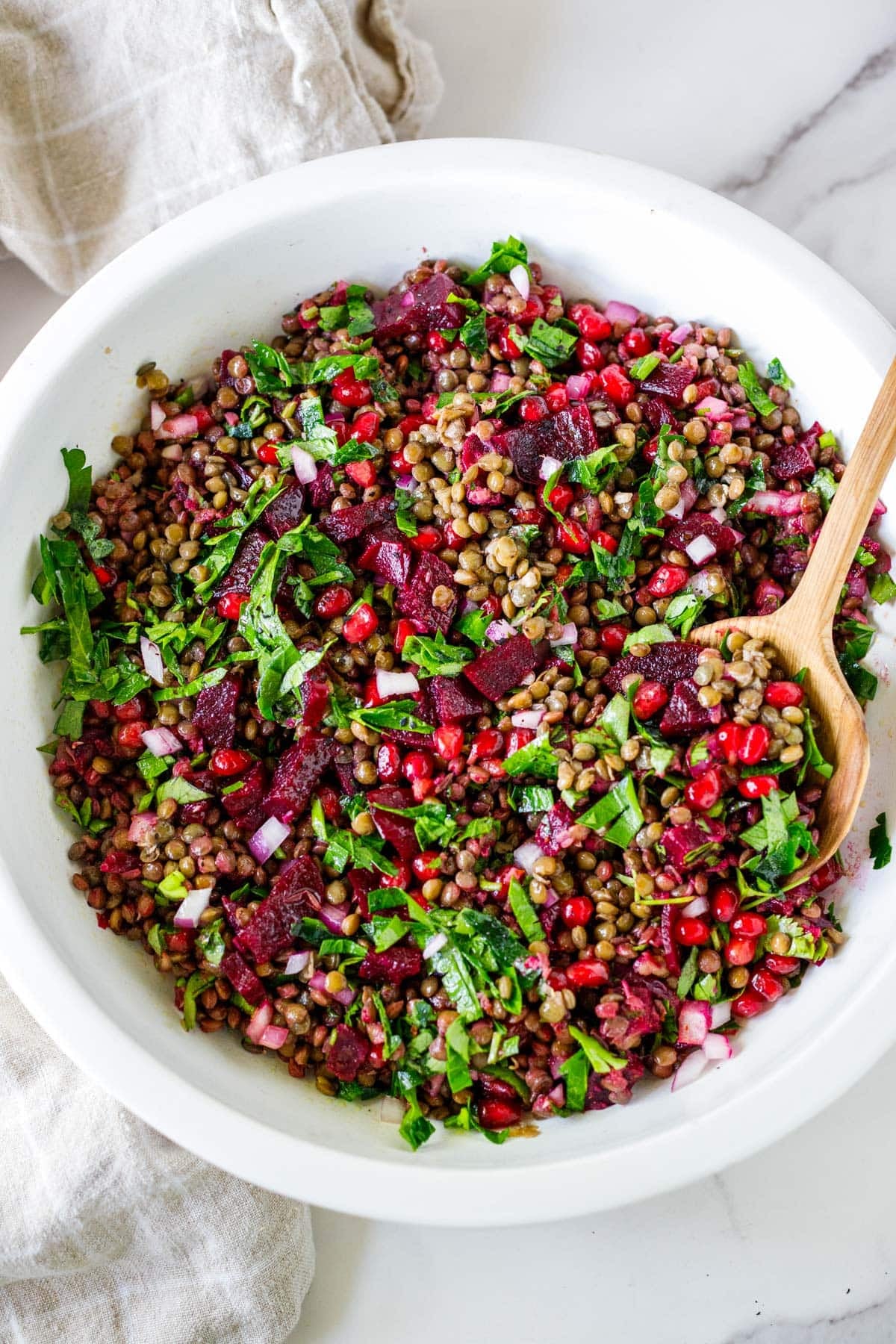 This lentil pomegranate salad is vibrant, flavorful, and packed with beets, herbs, and juicy pomegranate seeds. A healthy, protein-rich salad perfect for meal prep. Can also be served with tortilla chips for a festive appetizer dip. Vegan and Gluten-free.