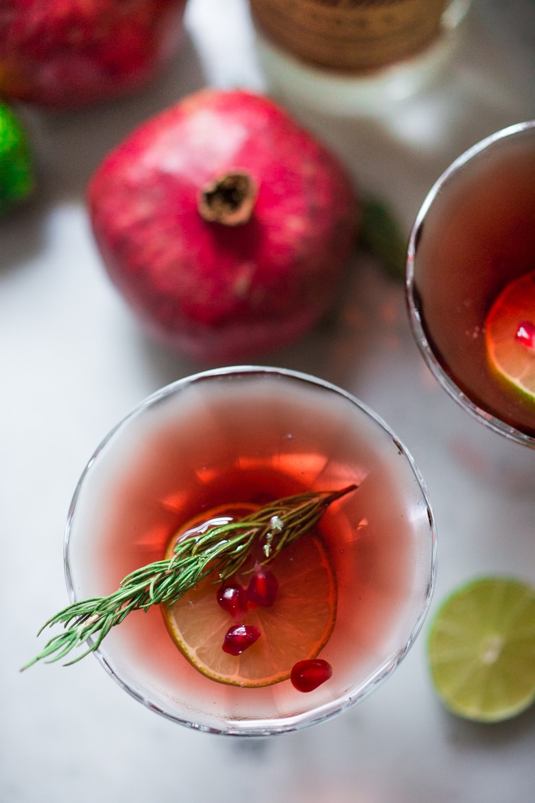 A simple recipe for a Pomegranate Drop with Rosemary ...a refreshing and festive holiday cocktail. | www.feastingathome.com