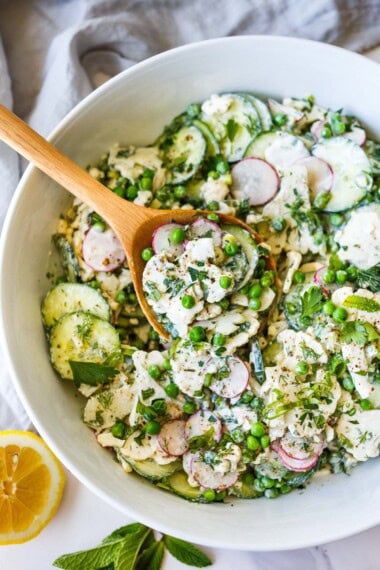 This vibrant cauliflower salad is packed with crisp cucumbers, sweet peas, fresh herbs, and tossed in a creamy garlic yogurt dressing that gets even more flavorful as it marinates.