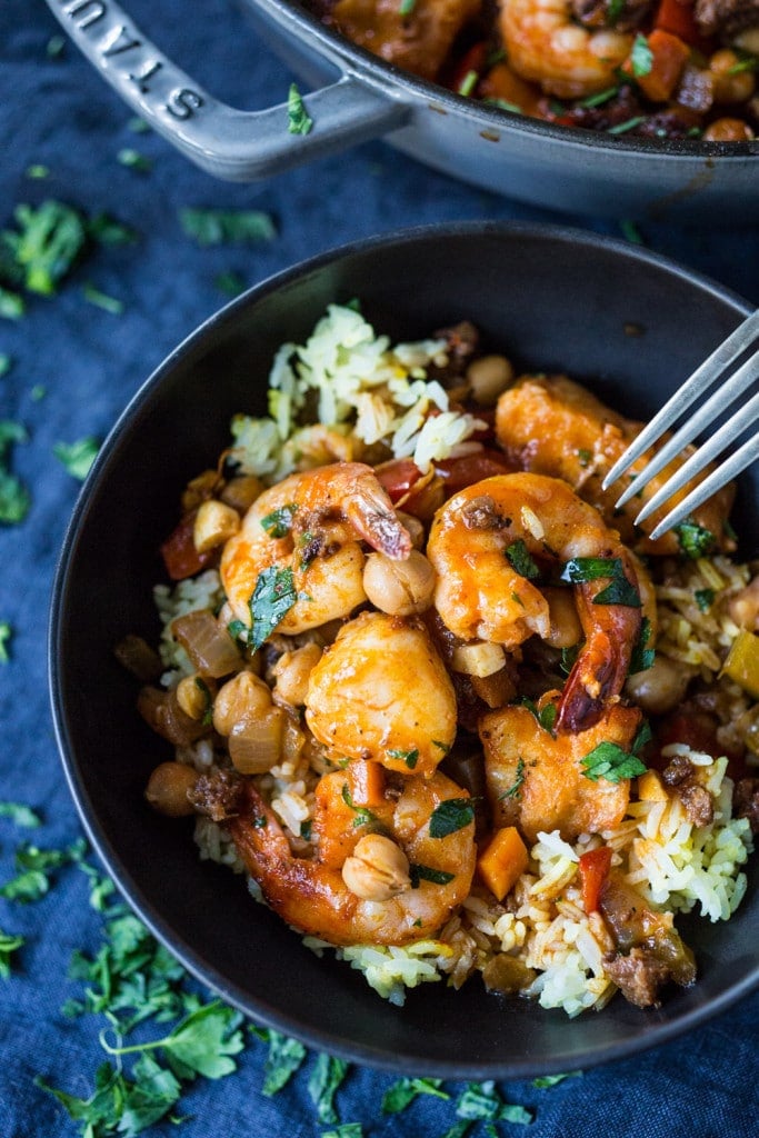 A simple delicious recipe for Spanish Seafood Stew with Garbanzo beans and Chorizo ( or soy Chorizo) served over Jasmine infused rice. | www.feastingathome.com