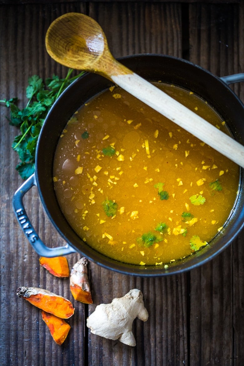 Turmeric Detox Broth- a naturally healing, soothing and comforting, Ayurvedic soup that very customizable to your needs. Vegan and GF adaptable! #ayervedic #ayerveda #feastingathome #vegan #glutenfree #broth #detox #detoxrecipes #eatclean #cleaneating #plantbased #vegansoup ##turmeric #clean-eating #turmericrecipes #turmericbroth #turmericsoup 