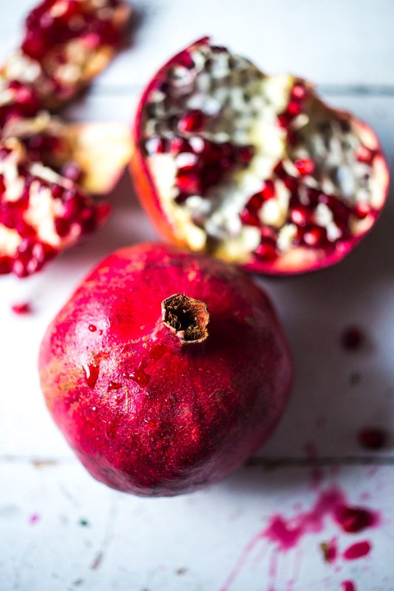 Holiday Crunch Salad - w/ Quinoa, Pomegranate Seeds, avocado, parsley and toasted Almonds...a healthy vegan gluten -free salad to your holiday table! | #vegansalad #healthysalad #christmassalad #pomegranate #quinoa #quinoasalad |www.feastingathome. com