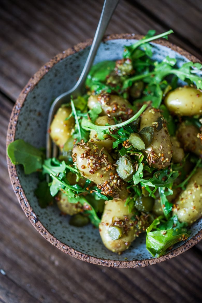 Vegan Potato Salad with Mustard Seed Vinaigrette (No Mayo!) A simple, healthy recipe, great for midweek lunches or make ahead for potlucks and gatherings. #veganpotatosalad #potatosaladrecipe #healthypotatosalad #nomayo #makeadheadsalad | www.feastingathome.com 