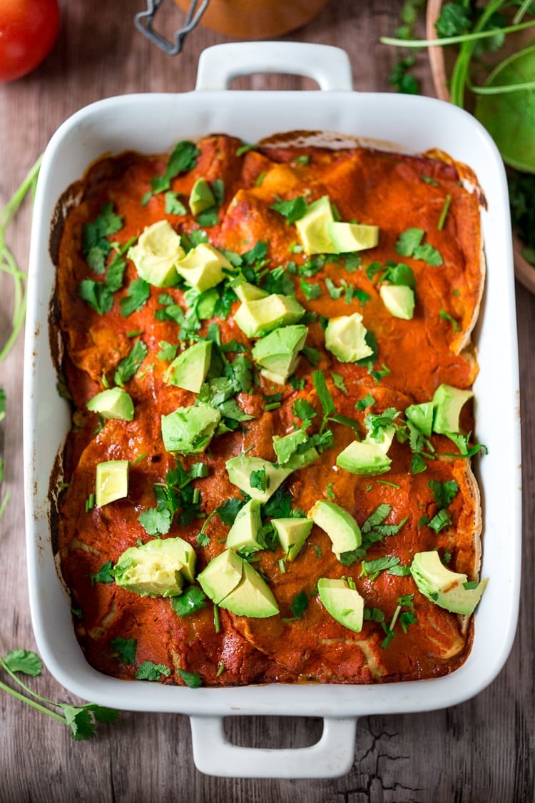 Simple Enchilada Casserole w/ Two Minute Enchilada Sauce! A fast and healthy version of enchiladas  made with layered tortillas instead of rolled- very time saving! Keep it vegetarian or add chicken! | www.feastingathome.com #enchilada #enchiladacassarole #enchiladas #vegetarian #chickenenchiladas