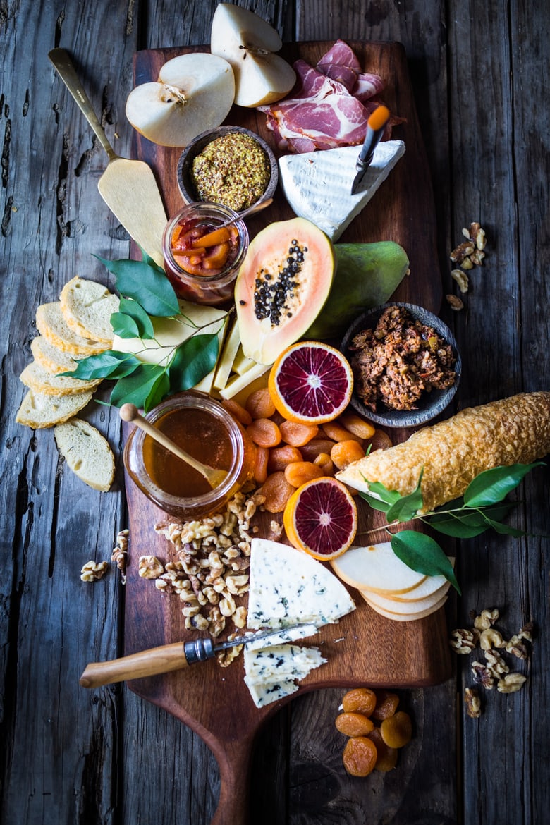 A Winter Cheese Board with Blood Orange Marmalade and Castello cheeses, winter fruits, nuts and honey...a match made in heaven. | www.Feastingathome.com 