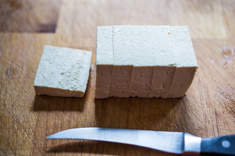 Trader Joe's Sprouted Tofu...and a tasty recipe for Garlic Chili Tofu with Sesame Broccolini- a delicious and fast, 15 minute dinner that is vegan and gluten free. Healthy & Yummy! | www.feastingathome.com