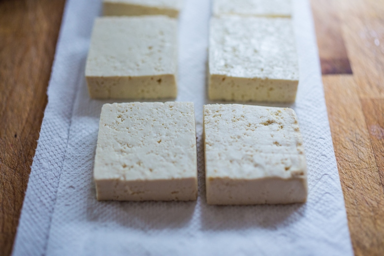 Trader Joe's Sprouted Tofu...and a tasty recipe for Garlic Chili Tofu with Sesame Broccolini- a delicious and fast, 15 minute dinner that is vegan and gluten free. Healthy & Yummy! | www.feastingathome.com