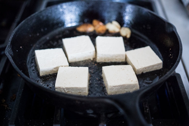 A Tasty recipe for Garlic Chili Tofu with Sesame Broccolini- a delicious and fast, 15 minute dinner that is vegan and gluten free. Healthy & Yummy! | www.feastingathome.com