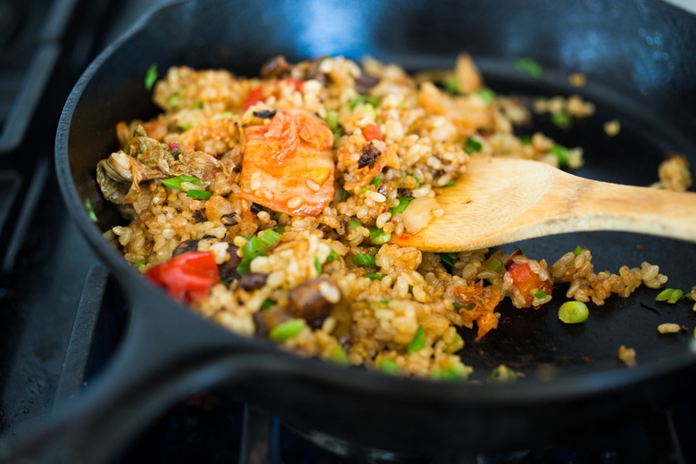 Kimchi Fried Rice! A fast and healthy weeknight dinner, packed with flavor & veggies, topped with an Egg ( or Tofu). Swap out Cauliflower Rice for Low Carb! Healthy and flavorful! #kimchirice #kimchfriedrice 