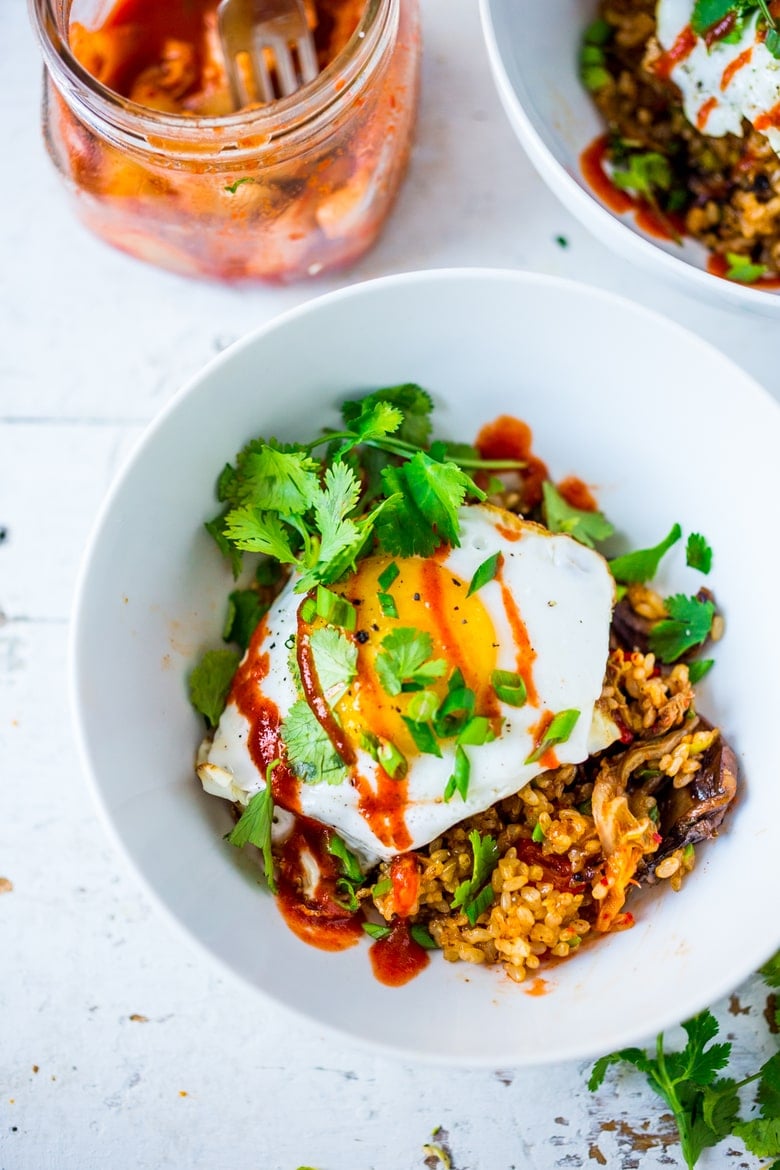 Kimchi Fried Rice, packed with flavor & veggies, topped with an Egg ( or Tofu). Swap out Cauliflower Rice for Low Carb! Healthy and flavorful! |www.feastingathome.com