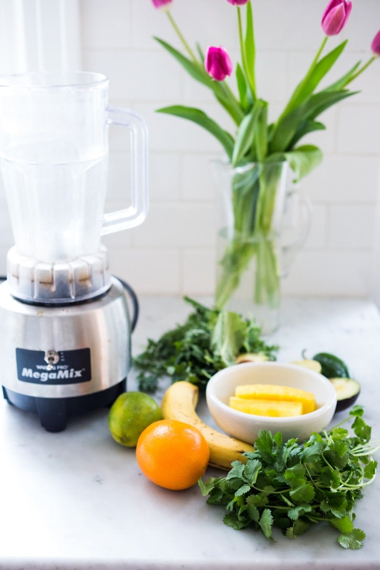 An energizing, spicy Mexican-style green smoothie with avocado, pineapple, cucumber, cilantro, jalapeño and lime! Refreshing, energizing and totally invigorating! Vegan! #vegan #detox #greensmoothie #greenjuice #vegangreensmoothie #avocadosmoothie #smoothie #eatclean #cleaneating #plantbased #vegansmoothie