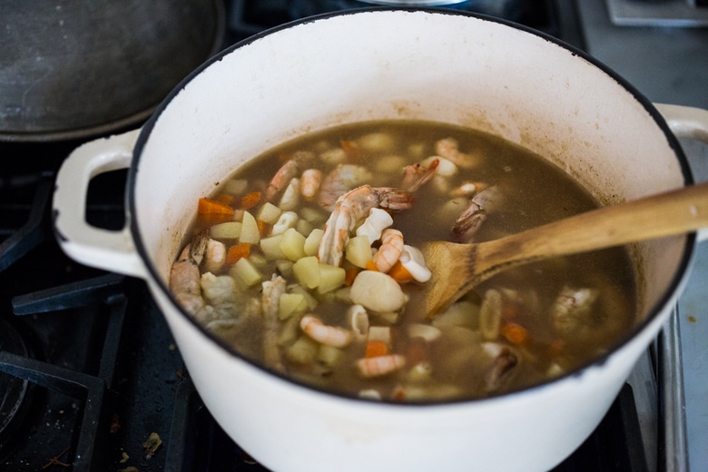 A delicious recipe for Peruvian Seafood Stew with Cilantro Broth, with potatoes and carrots. Healthy, Gluten free, Easy... and can be made in 35 minutes! | www.feastingathome.com