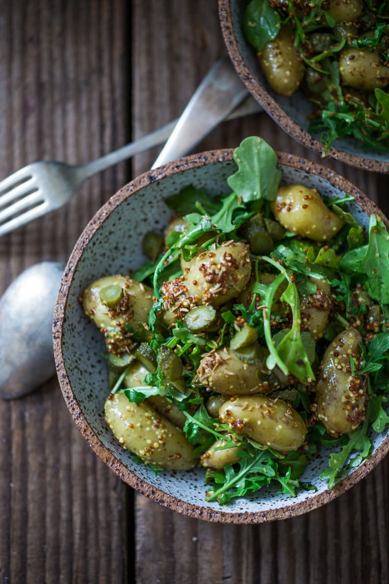 Vegan Potato Salad with Mustard Seed Vinaigrette (No Mayo!) A simple, healthy recipe, great for midweek lunches or make ahead for potlucks and gatherings. #veganpotatosalad #potatosaladrecipe #healthypotatosalad #nomayo #makeadheadsalad | www.feastingathome.com 