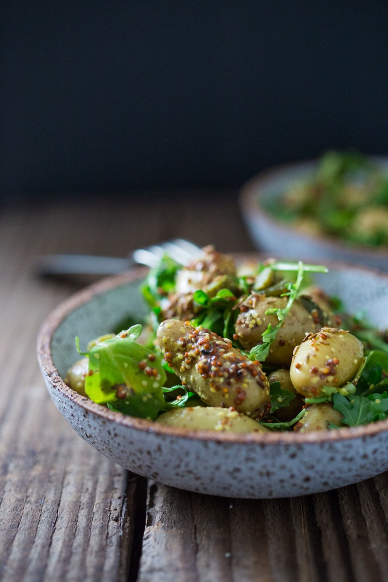 Vegan Potato Salad with Mustard Seed Vinaigrette (No Mayo!) A simple, healthy recipe, great for midweek lunches or make ahead for potlucks and gatherings. #veganpotatosalad #potatosaladrecipe #healthypotatosalad #nomayo #makeadheadsalad | www.feastingathome.com 