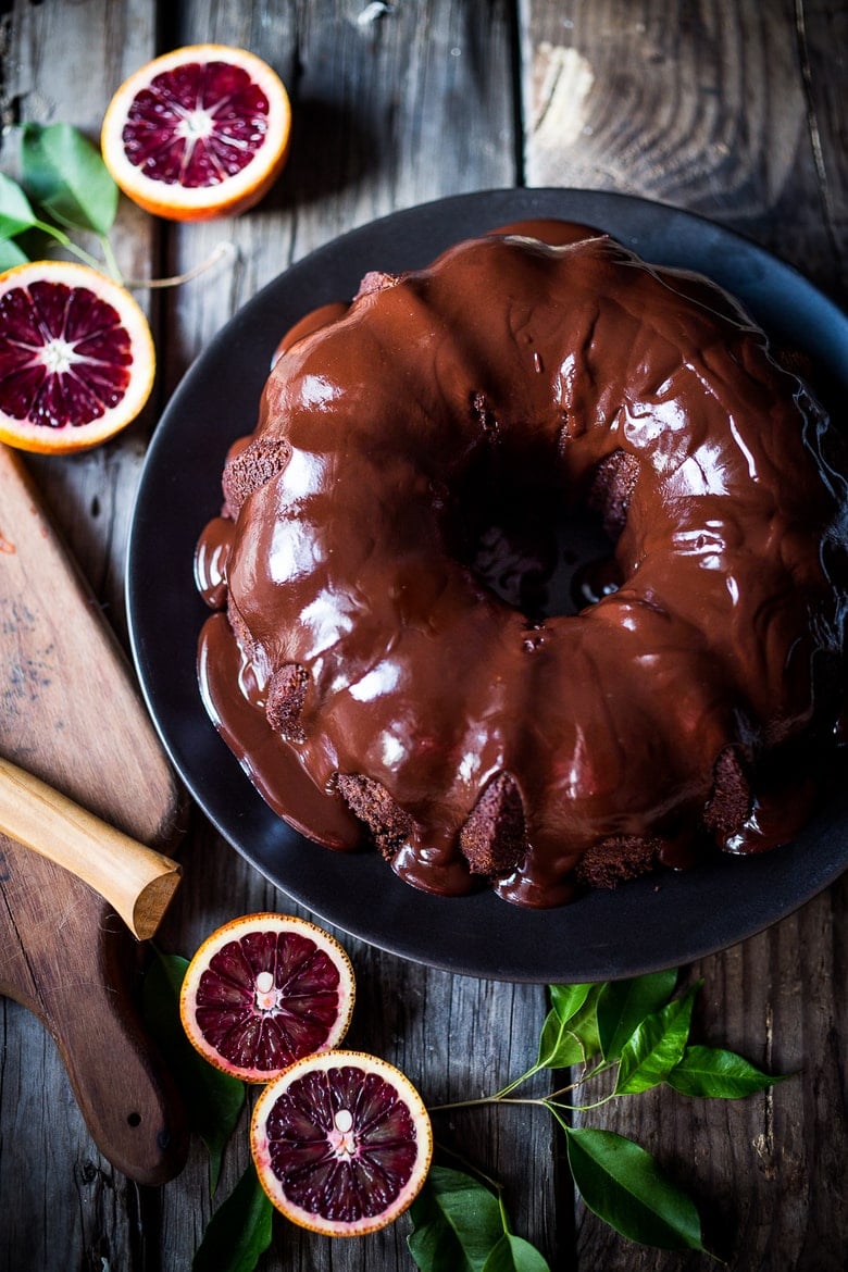 A delicious recipe for Dark Chocolate Bundt Cake with Blood Oranges and a Chocolate Ganache icing. Simple and scrumptious! | www.feastingathome.com