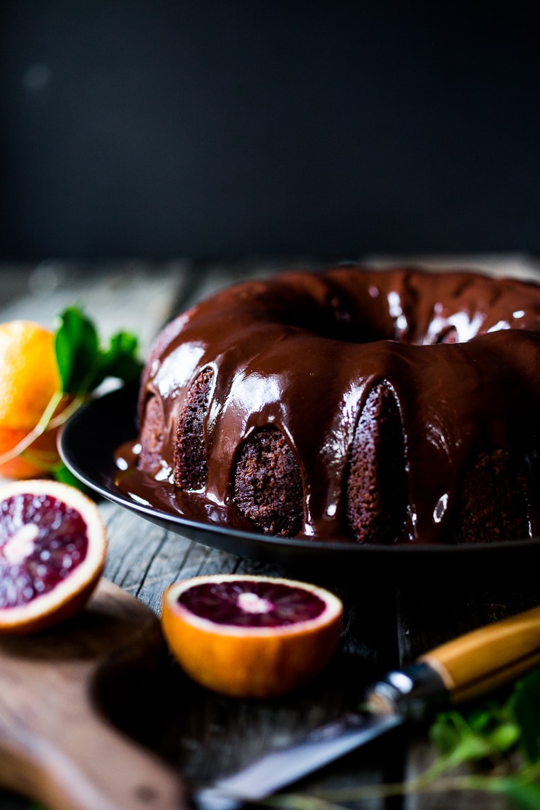 A delicious recipe for Dark Chocolate Bundt Cake with Blood Oranges and a Chocolate Ganache icing. Simple and scrumptious! | www.feastingathome.com