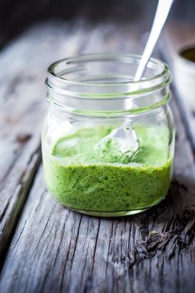 Green Harissa Sauce- a burst of North African flavor for buddha bowls, wraps, tacos, roasted veggies or whatever else you can think of! Vegan Adaptable! | www.feastingathome.com