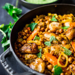A delicious Tunisian-inspired Chicken Tagine (or sub chickpeas) with couscous, carrots, and flavorful Green Harissa Sauce. A one-pan meal that can be made in 45 minutes! Vegan and Gluten-free adaptable!