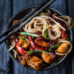 A simple delicious recipe for Kung Pao Noodles that can be made with chicken, tofu, fish, shrimp or veggies, served over noodles with a flavorful Kung Pao Sauce. | www.feasingathome.com