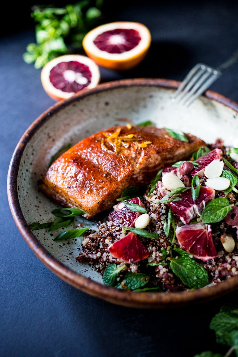 A delicious vegan Moroccan Salad with blood oranges, quinoa, almonds, olives, mint and a tangy, bright blood orange dressing. Perfect for the holiday table, this salad is festive and healthy! | #moroccansalad #bloodorange #bloodorangesalad #quinoasalad #vegansalad #holidaysalad #vegan #healthysalad www.feastingathome.com