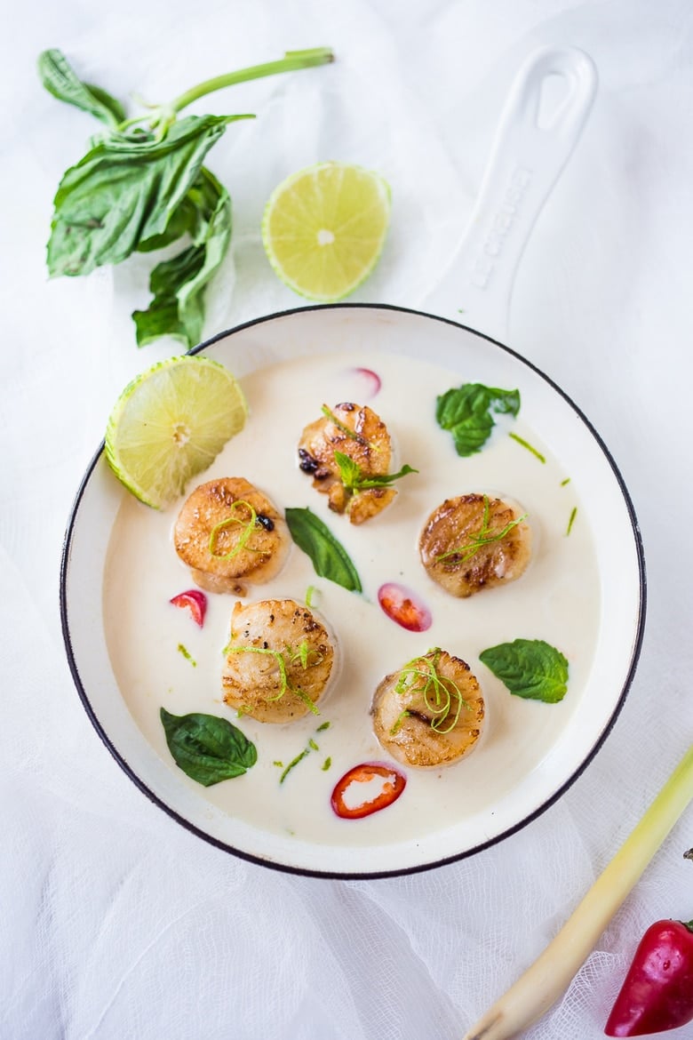 Seared Scallops with fragrant coconut lemongrass sauce, fresh basil and lime zest. FAST, Flavorful and easy to make. A Fresh and healthy recipe! | www.feastingathome.com