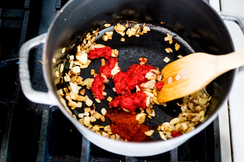 Smokey Tomato Detox Soup- a healing detoxing pot of soup- with beans, vegan "meat balls", spinach, pasta, or make it your own. Nutritious and cleansing. Vegan, Gluten Free. | www.feastingathome.com