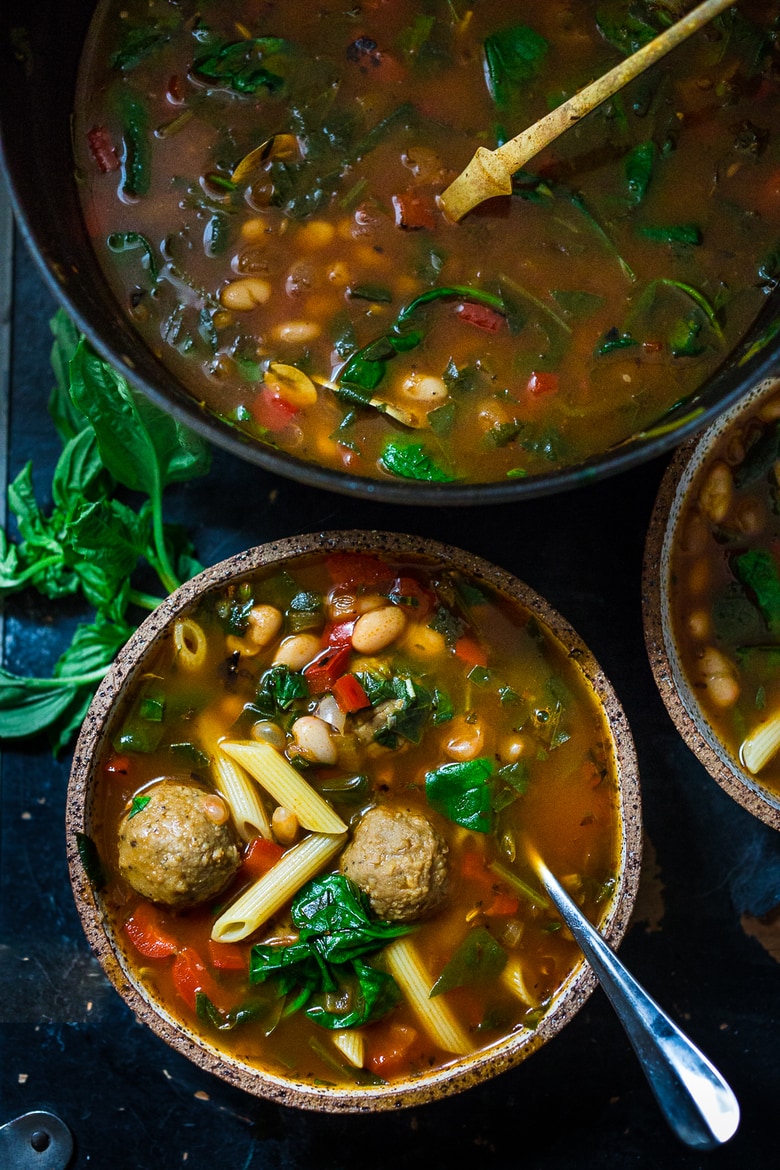 This vegan Minestrone Soup is made with pasta, spinach white beans, and vegan meatballs in a rich and smoky tomato broth. 