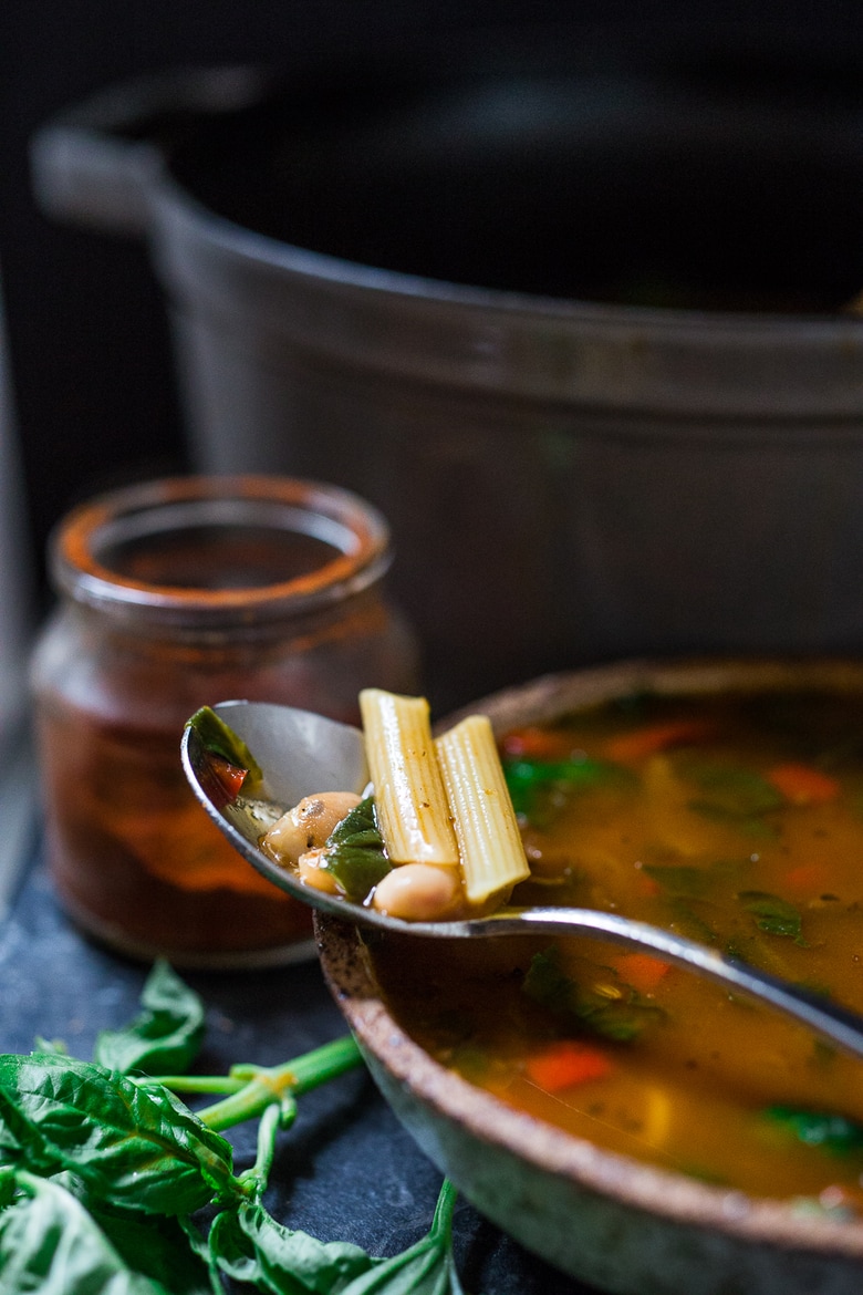 ( Vegan) Smoky Tomato Broth- a healing detoxing pot of soup- with beans, vegan "meat balls", spinach, pasta, or make it your own. Nutritious and cleansing. Vegan, Gluten Free. | www.feastingathome.com