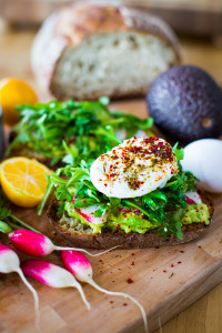 Avocado Toast with arugula, radish, poached #egglandsbest eggs and zataar spice! | ww.feastingathome.com