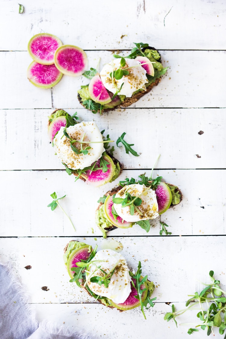 Avocado Toast with Poached Eggs, Arugula, radishes and Zaatar Spice! #avocadotoast #avocado #toast #brunch #breakfast