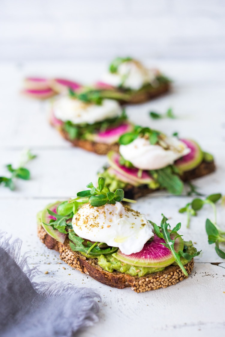 Avocado Toast with Poached Eggs, Arugula, radishes and Zaatar Spice! #avocadotoast #avocado #toast #brunch #breakfast