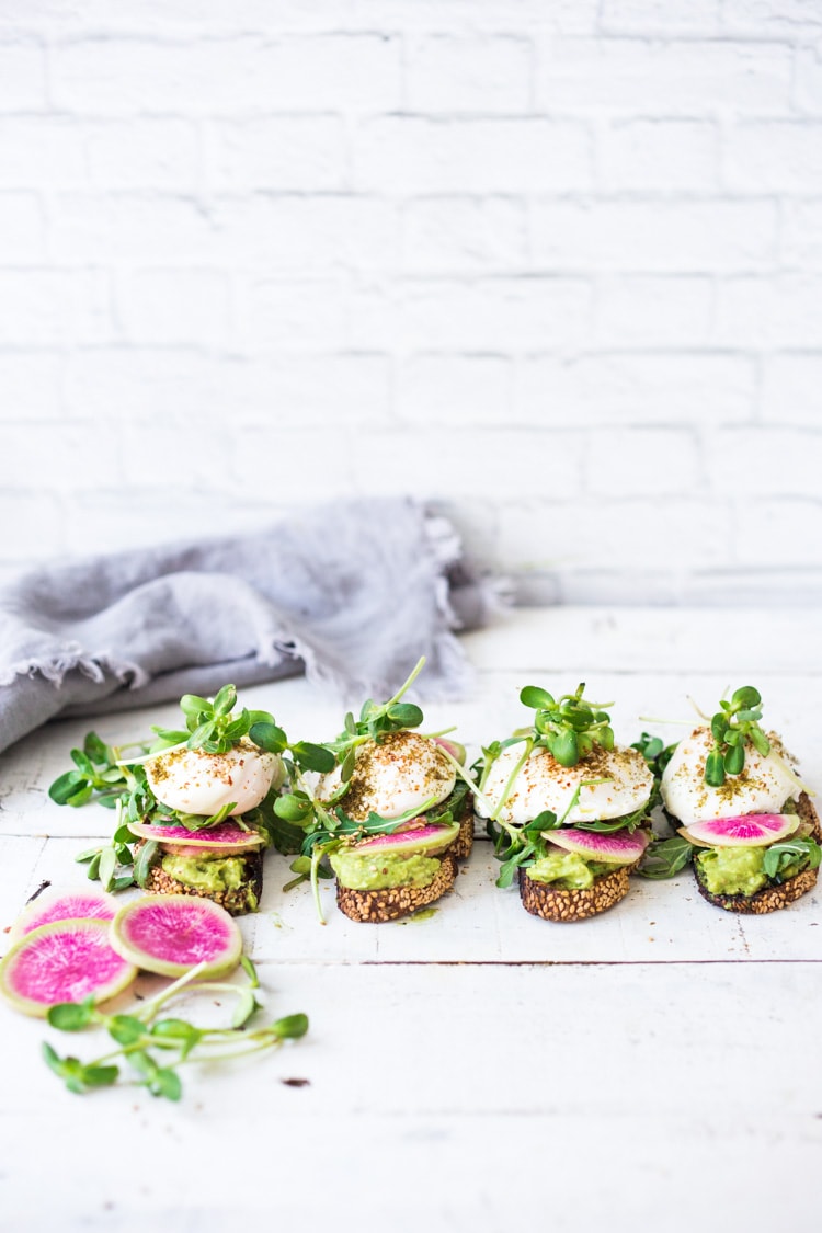 Avocado Toast with Poached Eggs, Arugula, radishes and Zaatar Spice! #avocadotoast #avocado #toast #brunch #breakfast