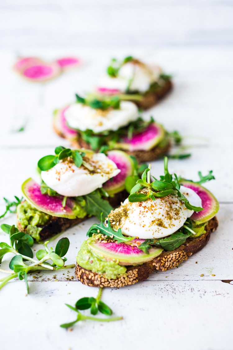 Avocado Toast with Poached Eggs, Arugula, radishes and Zaatar Spice! #avocadotoast #avocado #toast #brunch #breakfast