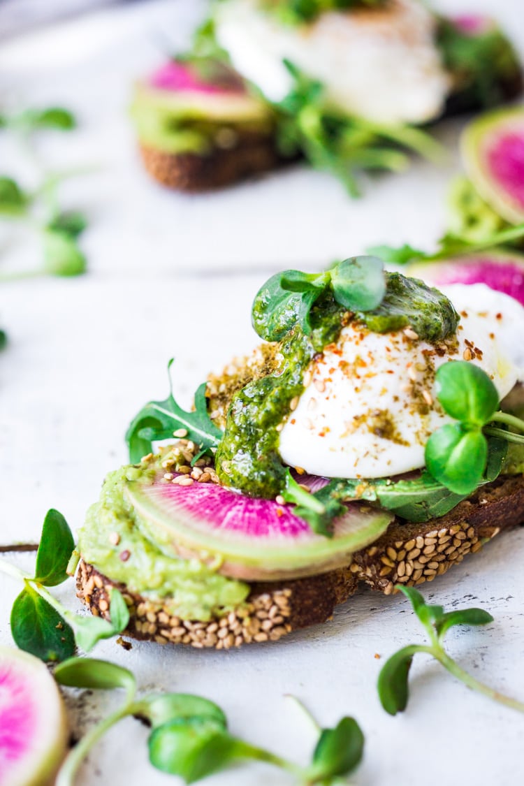 Avocado Toast with Poached Eggs, Arugula, radishes and Zaatar Spice! #avocadotoast #avocado #toast #brunch #breakfast