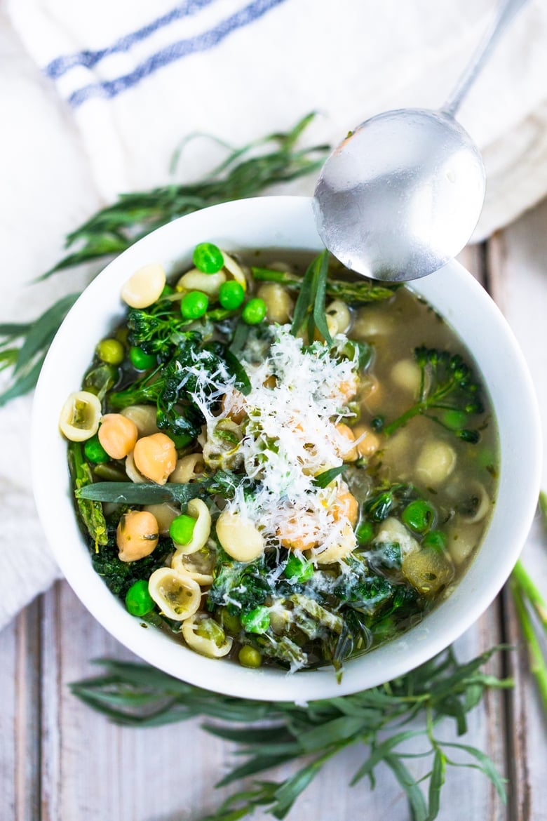 A delicious recipe for Minestrone Soup with Chickpeas and vibrant spring green vegetables. Keep it vegetarian or make it vegan- a simple adaptable recipe that makes for a healthy weeknight dinner. #minestronesoup #chickpeasoup #vegansoup