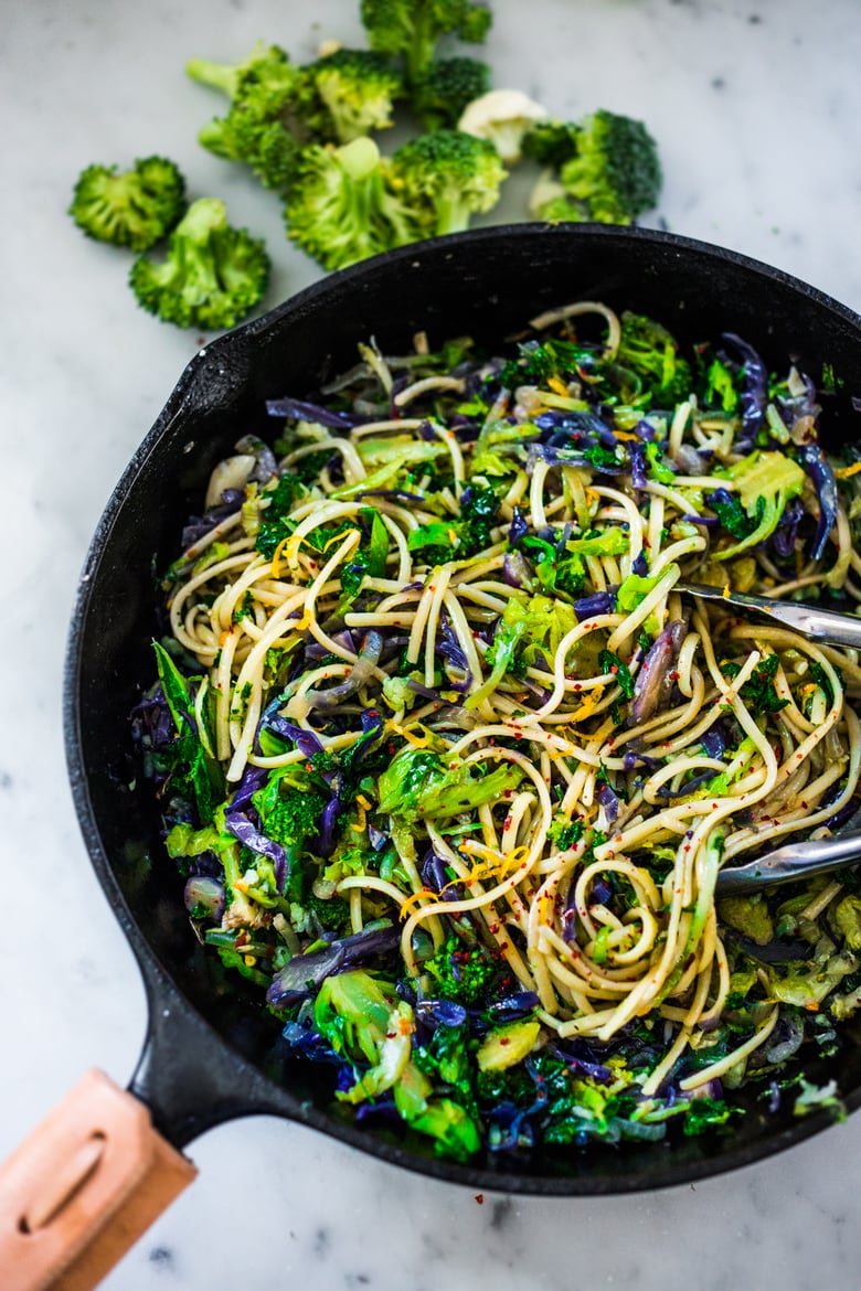 Our Best Plant-based Pasta Recipes: Garlicky Cruciferous Pasta- a simple vegan pasta dish loaded with shredded cruciferous vegetables like brussel spouts, broccoli and cauliflower with garlic, lemon zest and chili flakes. Trader Joe's carries a packaged "Cruciferous Mix" that is already shredded, making this dinner even more easy and fast!
