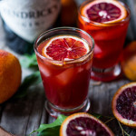 A Negroni is a classic Italian cocktail made up of Gin, Campari and Sweet Vermouth. Here we've simply substituted a blood orange instead of a regular orange for a more festive presentation. Shaken with ice and strained into a little glass -- it's one of my favorites.