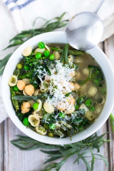 A delicious recipe for Spring Minestrone Soup with Chickpeas and vibrant spring green vegetables. Keep it vegetarian or make it vegan- a simple adaptable recipe that makes for a healthy weeknight dinner. 